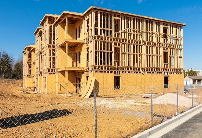 a close-up of temporary chain link fences enclosing a construction site, signaling progress in the project's development in Antioch, TN